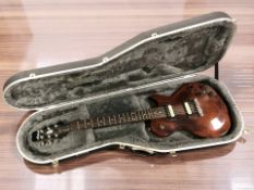 An Aria Pro II electric guitar, serial No. S7048068, made in Korea, in a hard shell guitar case.
