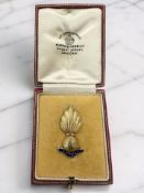 A gold and enamel Royal Artillery 'Ubique' grenade brooch, stamped 15ct, length 3.