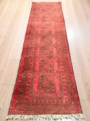 A Turkoman runner, Afghanistan, 292 cm x 83 cm.