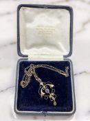 An Edwardian 9ct rose gold amethyst, peridot, and seed pearl pendant on chain, pendant 4.5cm long.
