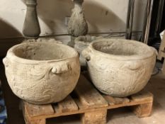 A pair of concrete classical style planters,