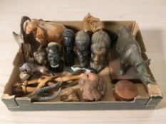 A group of African carved busts, figures of animals, large wall mask, etc.