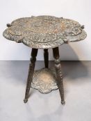 A heavily carved oak tripod occasional table,