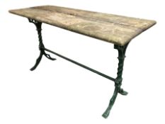 A painted cast iron framed rectangular patio table, 133 cm x 56 cm x 75 cm.