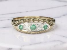 A 9ct gold emerald and diamond ring, size P CONDITION REPORT: 1.