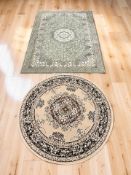 Two machine made rugs, the larger 200 cm x 135 cm.