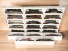 Twenty die cast model locomotives on plinths.