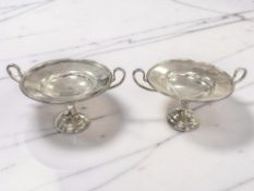 A pair of George V silver twin-handled bonbon dishes, London 1918, overall width 15.5cm.