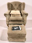 A contemporary Delcor wingback armchair and footstool, width 100 cm.