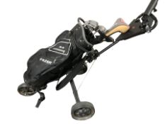 A Fazer golf bag on trolley containing Callaway Diablo Edge golf clubs.