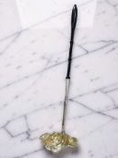 A Swedish silver-gilt and ebony toddy ladle, 19th century, length 39cm.