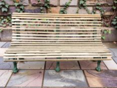 A painted cast iron and teak garden bench,