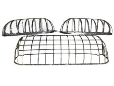 Three wrought metal basket planters, largest 110 cm wide.