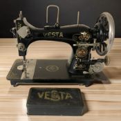An antique Vesta sewing machine.