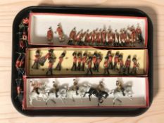 A group of Britains painted die cast marching band figures.