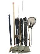 A group of fishing rods including Silstar, Seamaster, together with landing net, a pair of waders,