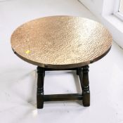 A copper topped pub style coffee table,