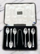 A set of six George V silver teaspoons and matching tongs, Birmingham 1912, cased.