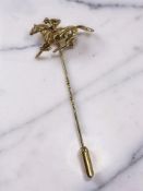 A 9ct gold jockey on horseback stick pin, length 6cm. CONDITION REPORT: 4.