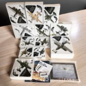 A group of die cast military aircraft.