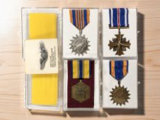 A group of medals including Civil Air medal, Distinguished Flying Cross,