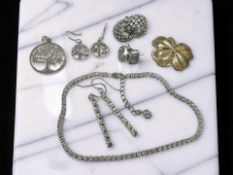 A silver and CZ bracelet, length 22cm, with a similar pair of earrings,