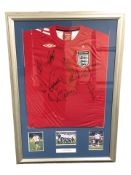 An Umbro England football shirt signed by the England squad 06/07,