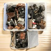 A collection of vintage 35mm film cameras including Canon A-1 with Canon FD 50mm 1:1.