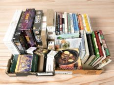 A group of cookery books, board games, jigsaws, etc.