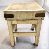 An antique pine butcher's block, width 62 cm.