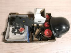 A group of air rifle shooting targets, tin of .177 caliber pellets, a helmet, etc.