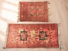 Two Turkoman rugs, Afghanistan, the larger 107 cm x 47 cm.