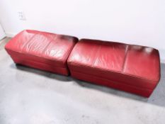 A pair of contemporary stitched red leather rectangular stools, length 92 cm.