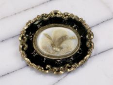 A Victorian black enamel memorial brooch, engraved with the name 'A. Gold' to the reverse, width 4.