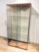 A pair of contemporary glazed display cabinets with internal shelves and keys,