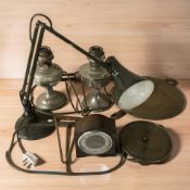 An enameled metal angle poise lamp, two chrome plated oil lamps, brass scales,