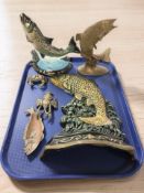 A group of metal fish and crustacean ornaments including a doorstop.