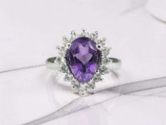 A sterling silver ring set with a Zambian Amethyst and White Topaz Stones, with certification,