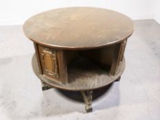 A 20th century oak two-tier circular occasional table,