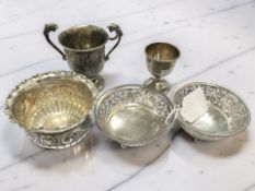 A pair of pierced silver bonbon dishes, together with an embossed silver sugar bowl,