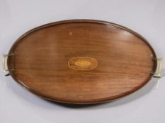 A late Victorian inlaid mahogany twin handled oval serving tray, width 62 cm.