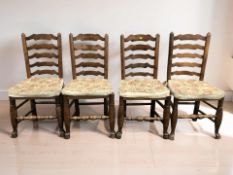 A set of four Edwardian oak beech and rattan farmhouse ladder back dining chairs.