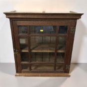 A Victorian glazed oak single door wall cabinet, width 62 cm.