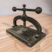 A Victorian cast iron book press, width 42 cm.