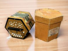A vintage concertina in box.