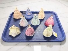 Nine miniature Coalport lady figures