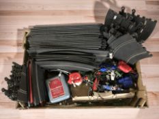 A group of vintage Scalextric cars, track and related items.