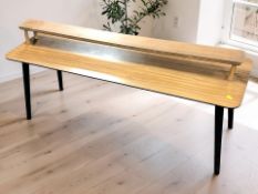 An ebonised and teak veneered rectangular coffee table, length 122 cm,