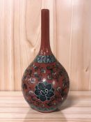 A Chinese style red glazed slender neck vase,