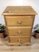 A 20th century pine three drawer bedside chest, width 43 cm.